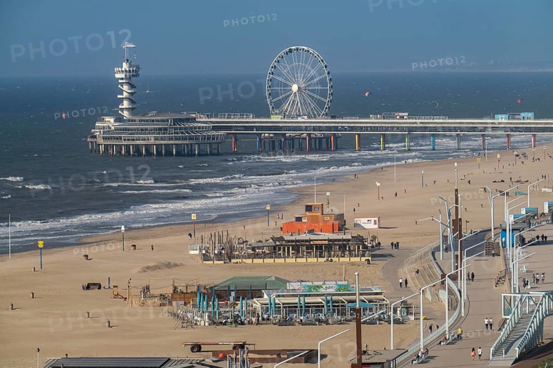 View over the beach of Scheveningen, the pier with Ferris wheel belongs to the city of The Hague and is the largest seaside resort in the Netherlands