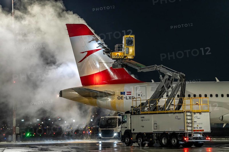 Winter at Frankfurt Main Airport, FRA, Austrian aircraft being de-iced by de-icing vehicles, Hesse, Germany, Europe
