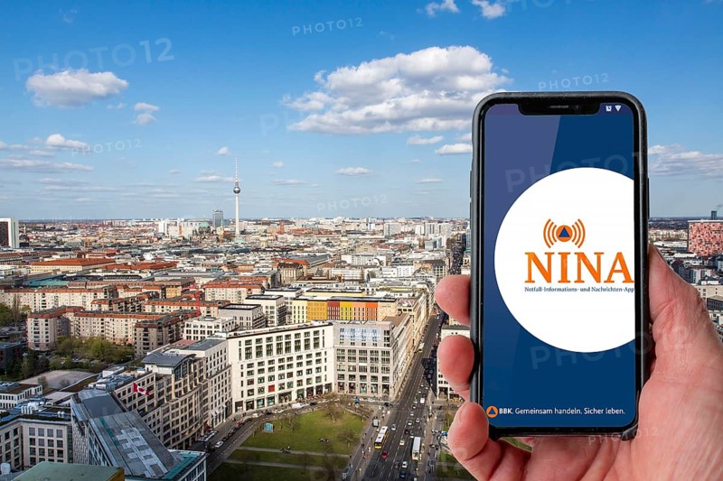 Symbolic image for NINA Warnapp, the Federal Office of Civil Protection and Disaster Assistance, warns the user of various dangers, disasters, storms, Berlin, Germany, Europe