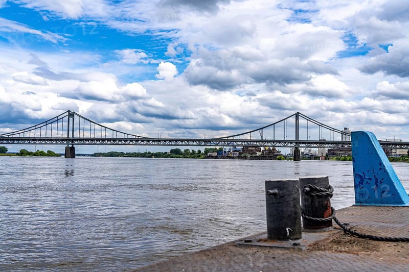 The Krefeld-Uerdingen Bridge over the Rhine, between Krefeld and Duisburg, bridle belt bridge from 1936, 858 metres long, federal road B228, shows severe bridge damage, restricted traffic on the bridge, to be replaced, cargo ship, North Rhine-Westphalia, Germany, Europe