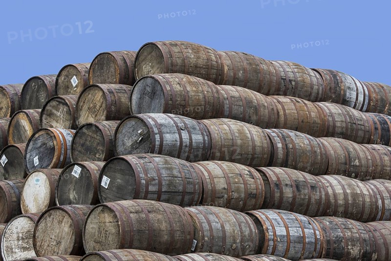 Huge stacks of discarded whisky casks, barrels at Speyside Cooperage, Craigellachie, Aberlour, Banffshire, Grampian, Scotland, UK