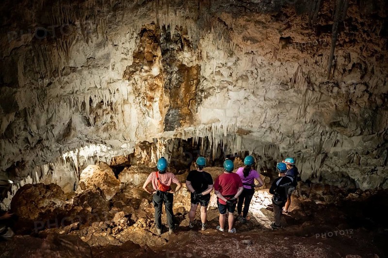 Visitors in a stalactite cave, tourists looking at stalactites in the Terciopelo Cave, Barra Honda National Park, Costa Rica, Central America
