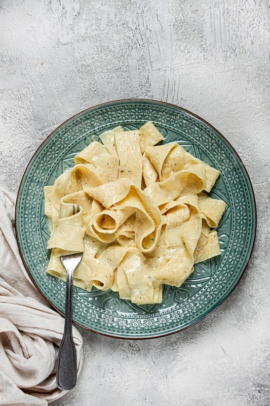 Pasta papardelle in creamy garlic sauce, traditional Italian cuisine, pasta carbonara, homemade, no people