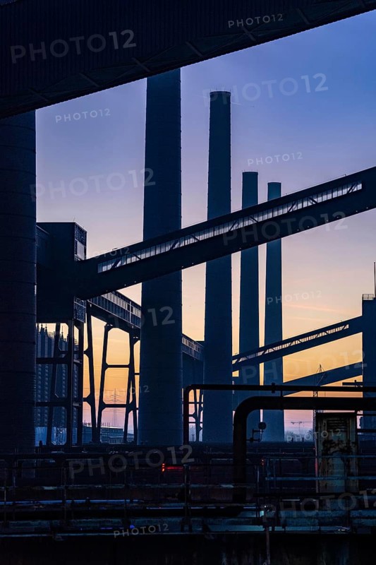 Zollverein Coal Mine Industrial Complex World Heritage Site, Zollverein coking plant, chimneys and conveyor bridges in the evening light, Essen, Germany, Europe