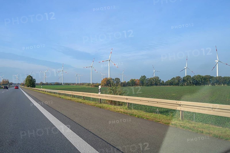 Wind turbines on the motorway. A9 motorway, Thuringia, Germany, Europe