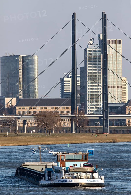 Düsseldorf, city centre skyline, skyscrapers, Rheinkniebrücke, Rhine, cargo ship