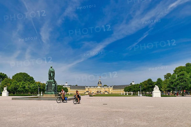 Karlsruhe, Germany, August 2021: Town square called 'Schlosplatz' in front of baroque Karlsruhe Palace with garden, Europe
