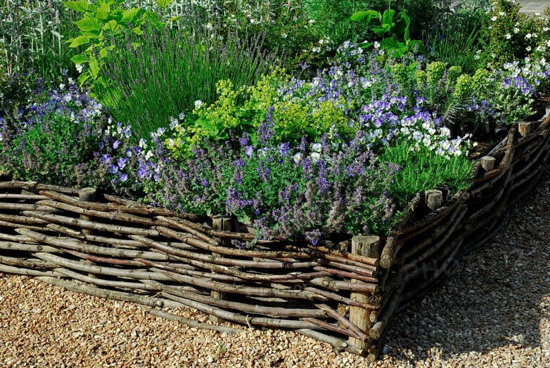 Flowerbed with willow fence
