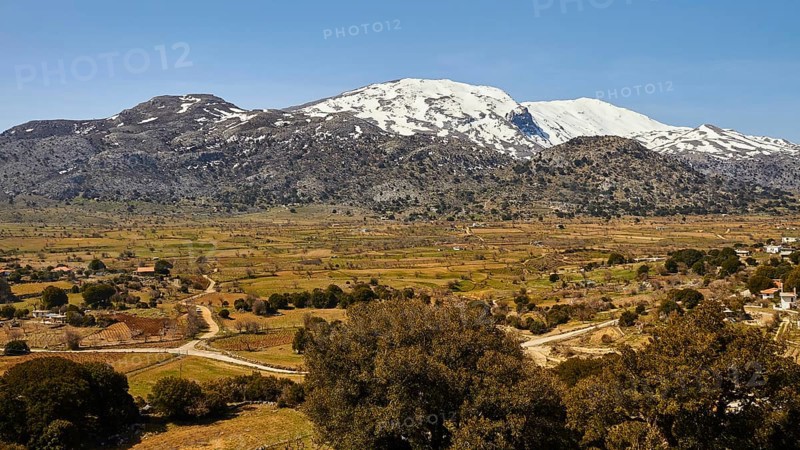 Katharo plateau, fields, trees, snow-capped mountains, Lassithi, East Crete, island of Crete, Greece, Europe