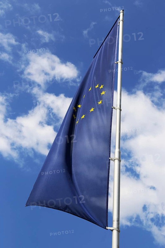 Flag of the European Union in front of a blue sky (Flag of the European Union in front of a blue blue sky)