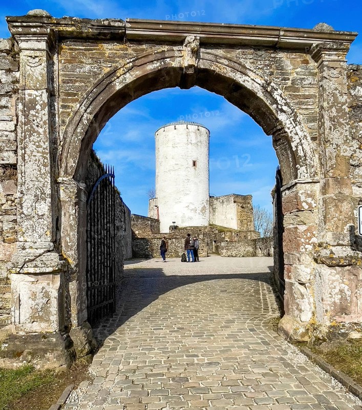 View through historic castle gate to old tower Castle tower of castle ruins Reifferscheid Castle, Eifel, Hellenthal, Euskirchen district, North Rhine-Westphalia, Germany, Europe