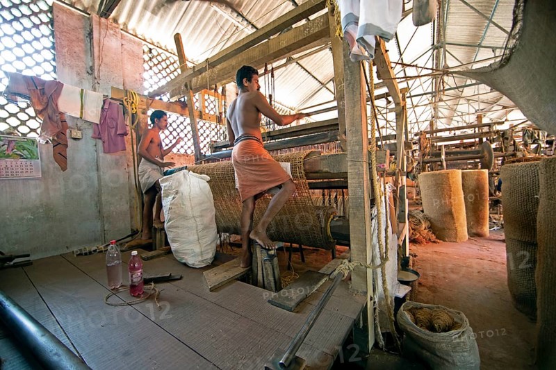 Indian workers in the weaving mill of the Labourers Coir Mats and Mattings Cooperation, coir mat production, Muhamma, Alappuzha, Kerala, India, Asia