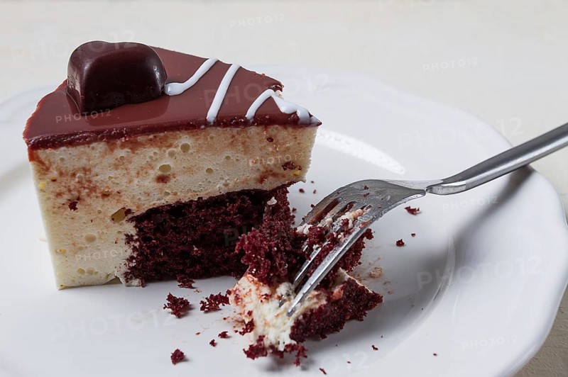 Slice of cake, bird's milk, chocolate sponge cake with souffle, sweet dessert, on a white plate, close-up, horizontal, no people