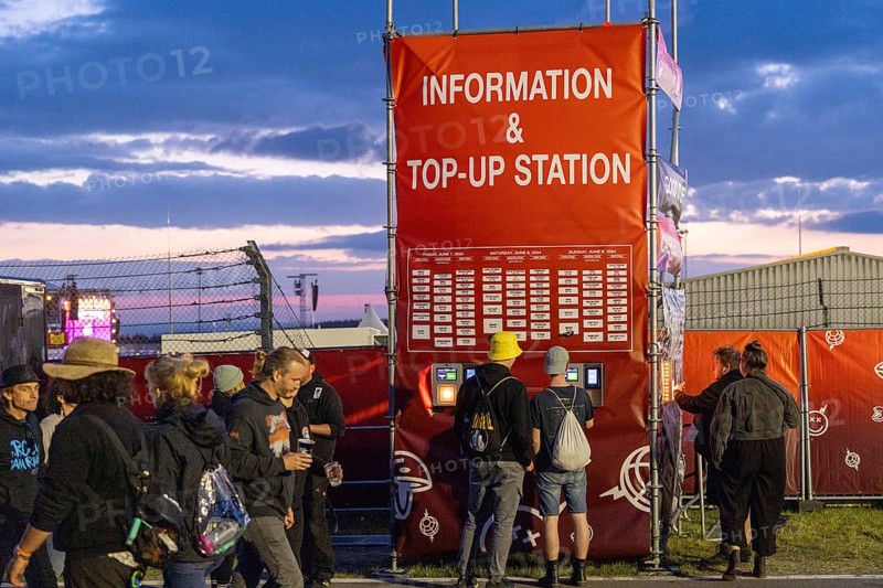 Adenau, Germany, 8 June 2024: Charging station for the cashless payment system at the Rock am Ring Festival. The festival takes place at the Nürburgring race track near the town of Adenau from 7 to 9 June 2024, Europe