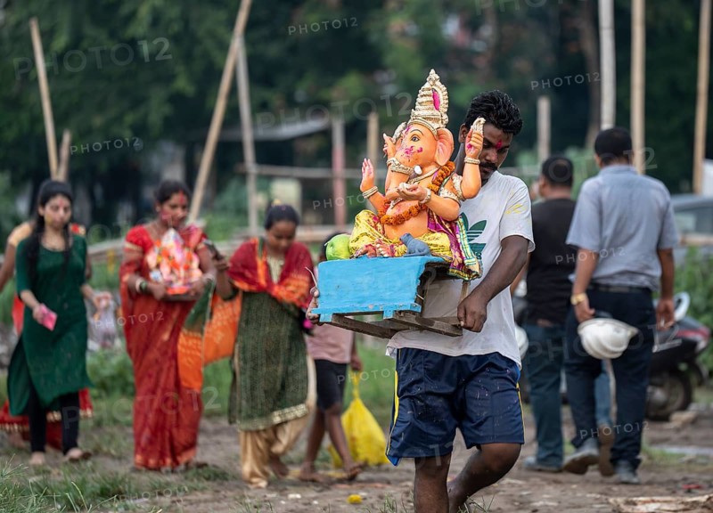 Devotees carries the Ganesha idol to immerse in the Brahmaputra river, during Ganesh Chaturthi festival, in Guwahati, Assam, India on Saturday, 9 Sept 2024