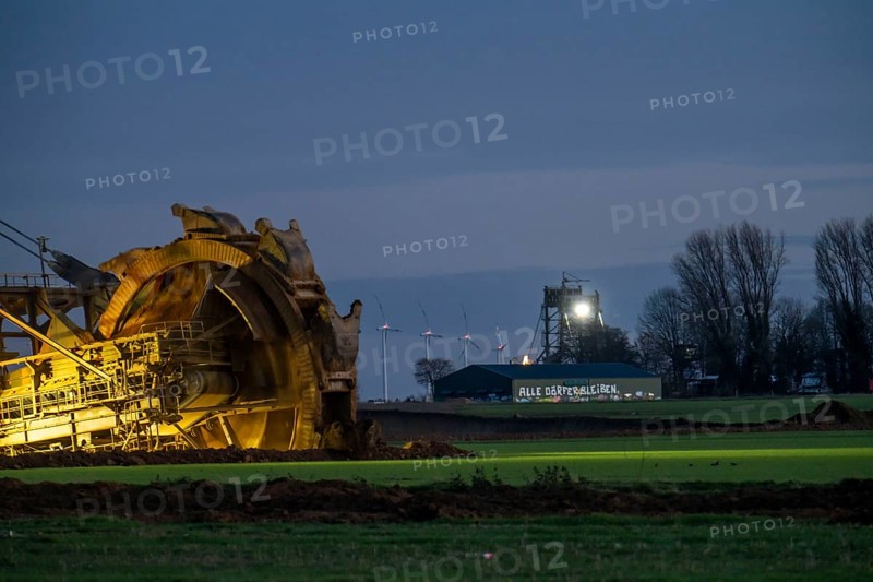 Two excavators are working around the hamlet of Lützerath, occupied by climate activists, the remains of the village are to make way for lignite mining, an eviction is imminent, North Rhine-Westphalia, Germany, Europe
