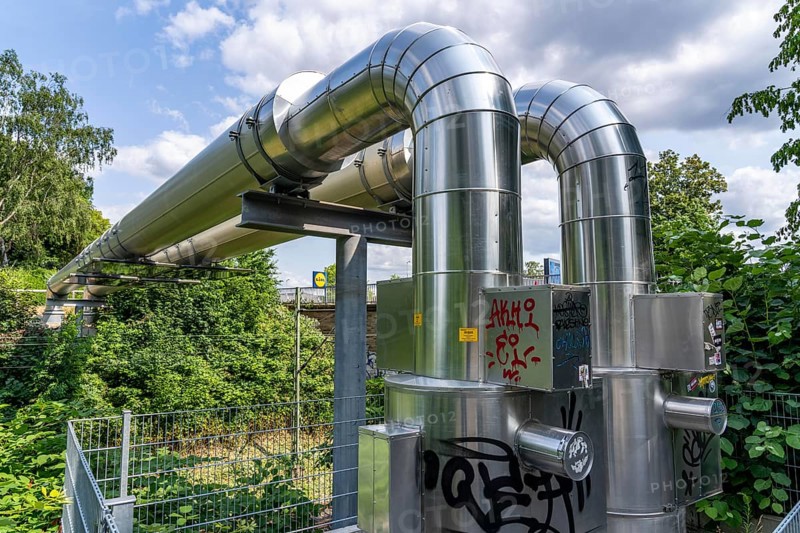 New STEAG district heating pipeline in Essen, over the railway tracks of the S6 line in Essen-Süd, part of the new 12 km long eastern route through the city, North Rhine-Westphalia, Germany, Europe