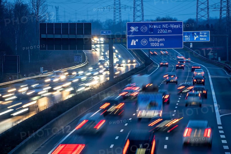 A57 motorway near Kaarst in the Rhine district of Neuss, view in the direction of the Büttgen junction, heavy evening traffic, overhead power lines, along the motorway, North Rhine-Westphalia, Germany, Europe