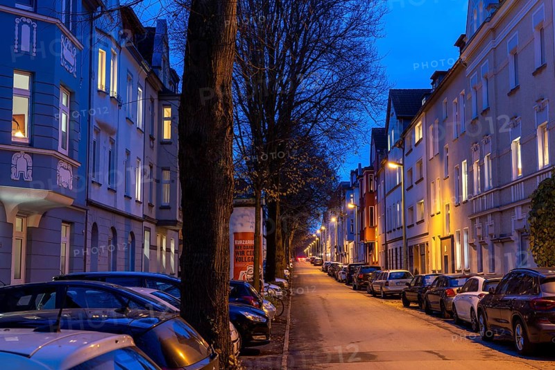 Residential street, many apartment buildings in a residential neighbourhood, evening, lantern lighting, Essen, North Rhine-Westphalia, Germany, Europe