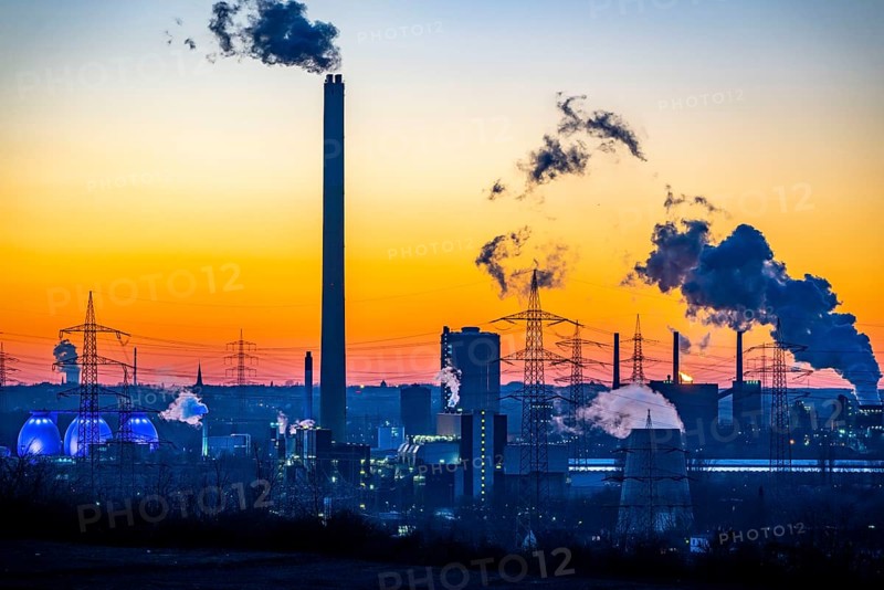 Prosper coking plant, operated by the ArcelorMittal steel group, 146 coke ovens with a daily output of 5500 tonnes of coke, extinguishing cloud, digestion towers of the Emscher sewage treatment plant, Bottrop, North Rhine-Westphalia, Germany, Europe