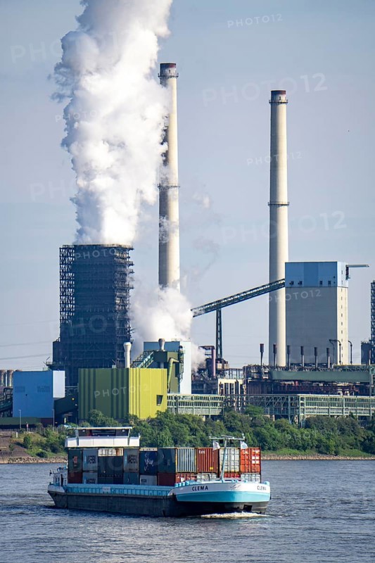 ThyssenKrupp steelworks in Duisburg-Marxloh, Schwelgern coking plant, chimney of the sintering plant, container cargo ship on the Rhine, Duisburg, North Rhine-Westphalia, Germany, Europe