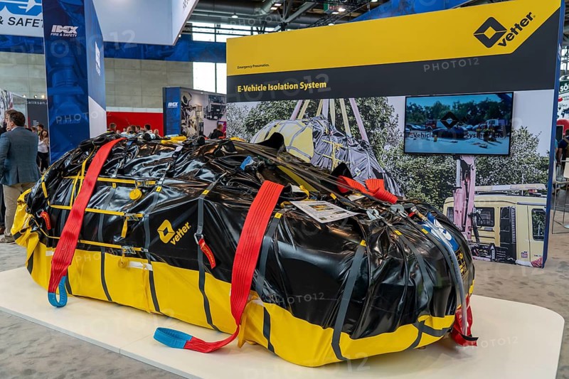 Interschutz 2022 trade fair in Hanover, the world's largest trade fair for fire, rescue and disaster control technology, equipment, over 1300 exhibitors from 50 countries, packaging of electric vehicles after a battery fire, in a fireproof cover for safe transport