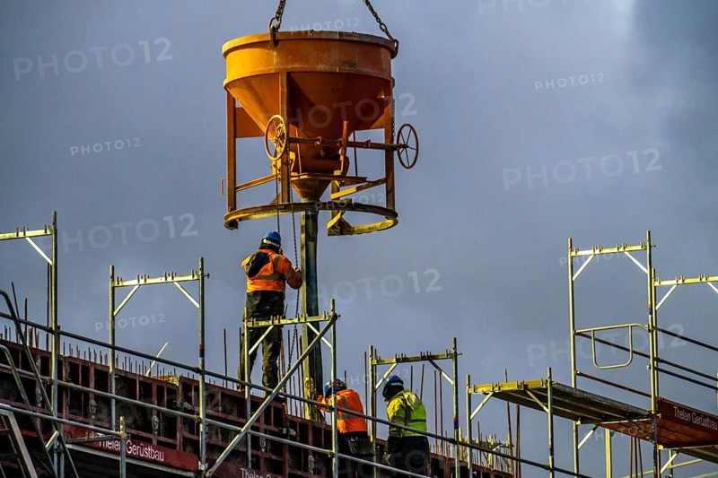 Concrete work, at dusk, on a large construction site building a residential and commercial complex, North Rhine-Westphalia, Germany, Europe