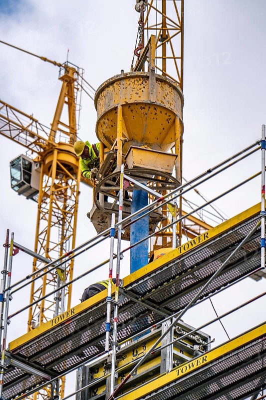 Concreting work on a construction site, new construction of a high-rise office building, facade of the shell, scaffolding, Cologne, North Rhine-Westphalia, Germany, Europe