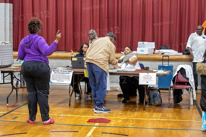 Detroit, Michigan USA, 5 November 2024, A voter gets his ballot for the 2024 presidential election shortly after the polls opened at Bethany Lutheran Church