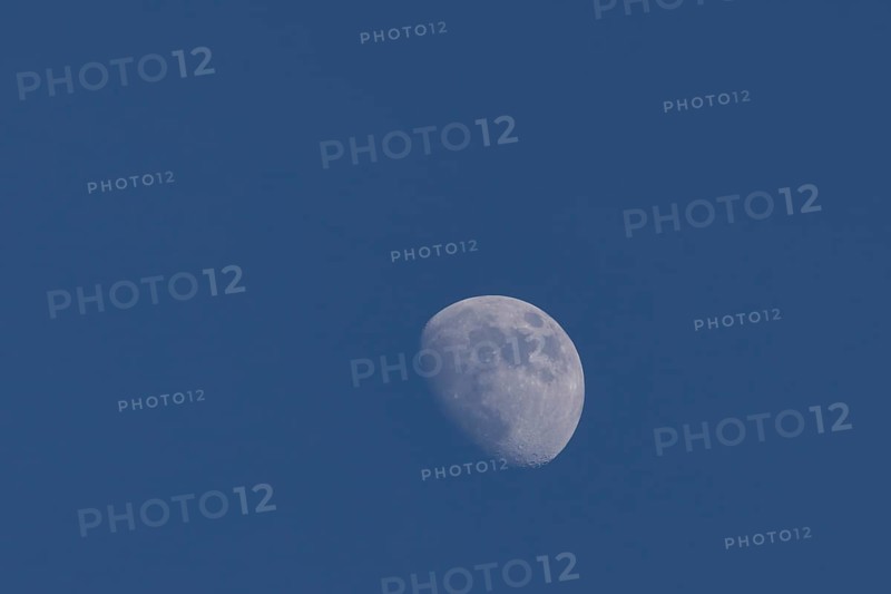 Moon in the waxing gibbous phase in the night sky, Suffolk, England, United Kingdom, Europe