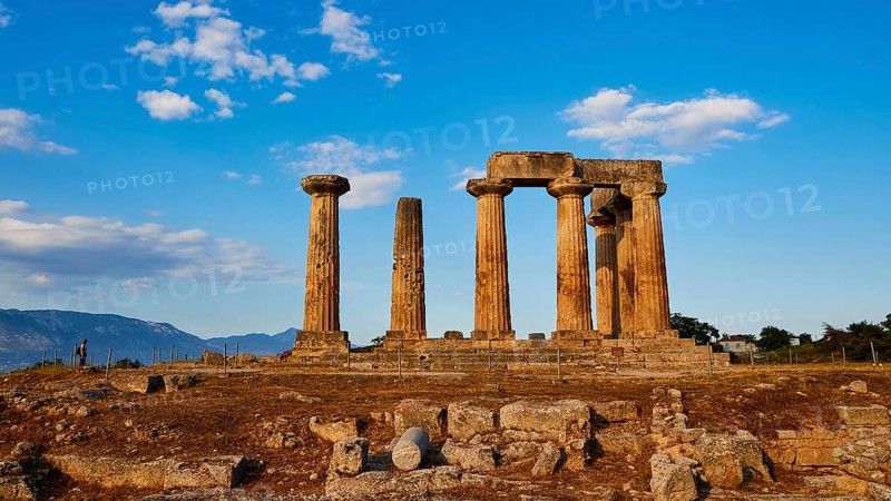 Archaic Temple of Apollo, Doric columns, Sunset light illuminates the columns and ruins of a historic temple, Archaeological site, Archea Korinthos, Corinth, Peloponnese, Greece, Europe