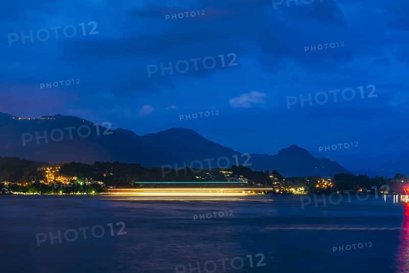 Nautical Vessel on Lake Lucerne in Long Exposure at Night with Mountain in Switzerland
