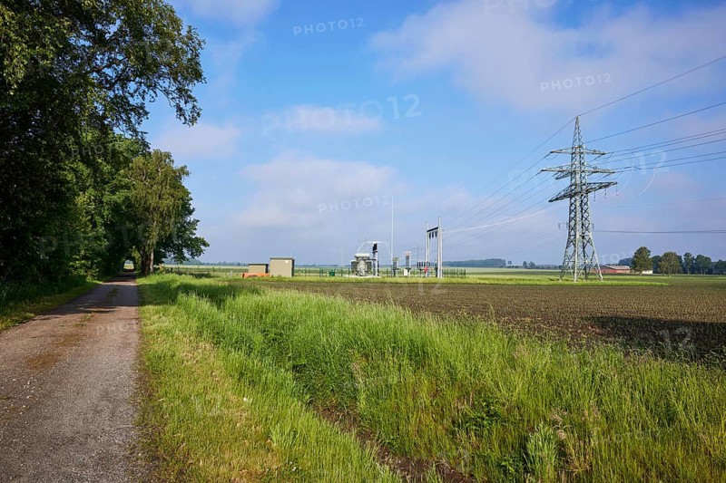 Substation in agricultural landscape with field path and trees near Beckdorf, district of Stade, Lower Saxony, Germany, Europe
