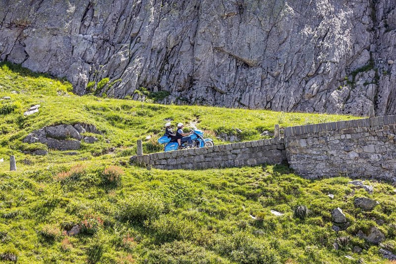 La Tremola, the world-famous serpentine road through the Val Tremolo, Switzerland's longest road monument with 24 hairpin bends. A popular leisure activity for owners of sports cars or vintage cars is the tour over the winding Alpine pass. Airolo, Canton Ticino, Switzerland, Europe