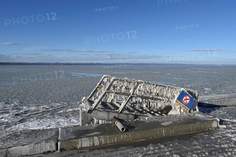 Frozen lake, ice and structures on iron ladder, Illmitz, Lake Neusiedl, Burgenland, Austria, Europe