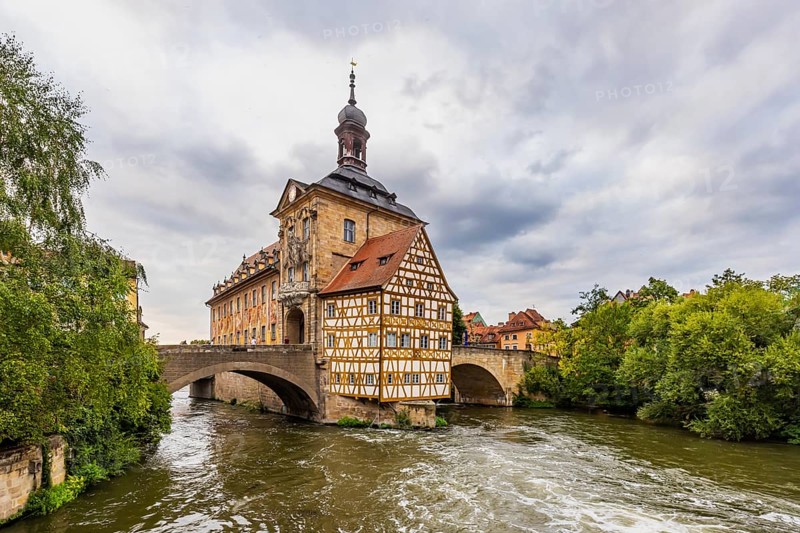 Old Town Hall on an artificial island in the River Regnitz. The landmark can be reached via two arched bridges. City view of Bamberg, Upper Franconia, Bavaria, Germany, Europe