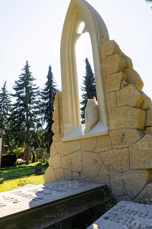 A new monument can be seen at Caspar David Friedrich's grave in Dresden's Trinitatisfriedhof cemetery to mark the 250th birthday of the most famous Romantic artist. The Gothic church window made of sandstone with an owl in rear view on the ledge. The construction was supported by the actor and Friedrich admirer Tom Pauls, Grave of Caspar David Friedrich, Dresden, Saxony, Germany, Europe