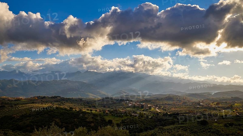 Green landscape with hills under a sunny sky with clouds, Lefka Ori, White Mountains, Mountain massif, West, Crete, Greece, Europe