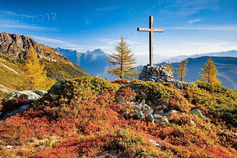 View of the Valais mountains and the Rhone valley with summit cross in autumn, Lower Valais, Switzerland, Europe