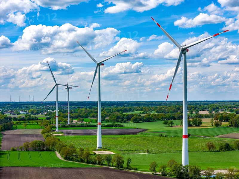 Wind farm, wind turbine, wind turbines from the manufacturer Enercon, in front and Nordex, behind blue sky with many white clouds, near Schermbeck North Rhine-Westphalia, Germany, Europe