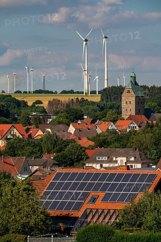 Wind farm near the East Westphalian town of Energiestadt Lichtenau, many residential buildings with photovoltaic systems on the roofs, over 80 wind turbines on this hill, in total there are more than 200 wind turbines around the town, producing 9 times more electricity than the town itself consumes, the rest is fed into the grid, North Rhine-Westphalia, Germany, Europe