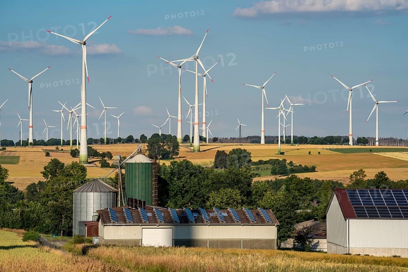 Wind farm near the East Westphalian town of Energiestadt Lichtenau, agricultural business with photovoltaic system, over 80 wind turbines on this hill, in total there are more than 200 wind turbines around the town, producing 9 times more electricity than the town itself consumes, the rest is fed into the grid, North Rhine-Westphalia, Germany, Europe