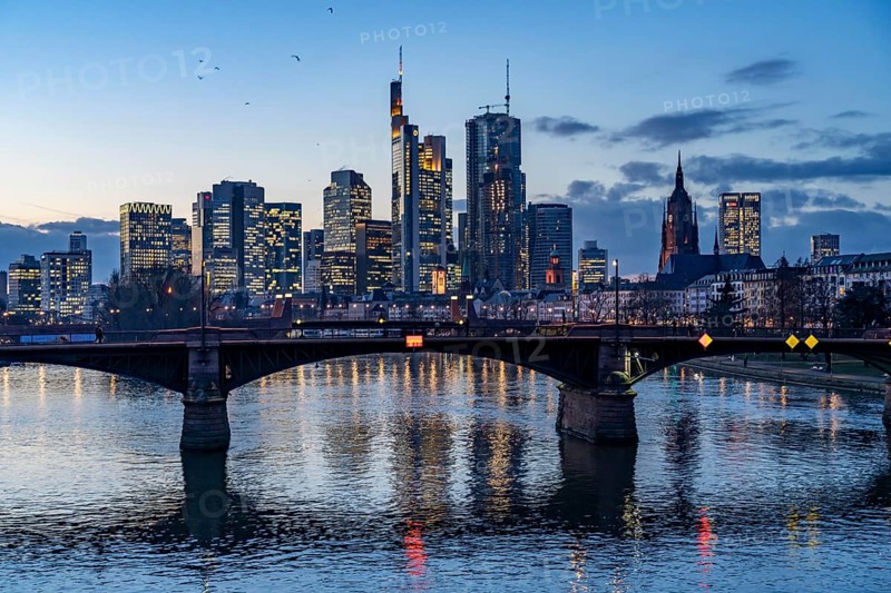 Skyline of the city centre of Frankfurt am Main, river Main, dusk, Ignatz-Bubis-Brücke, Hesse, Germany, Europe
