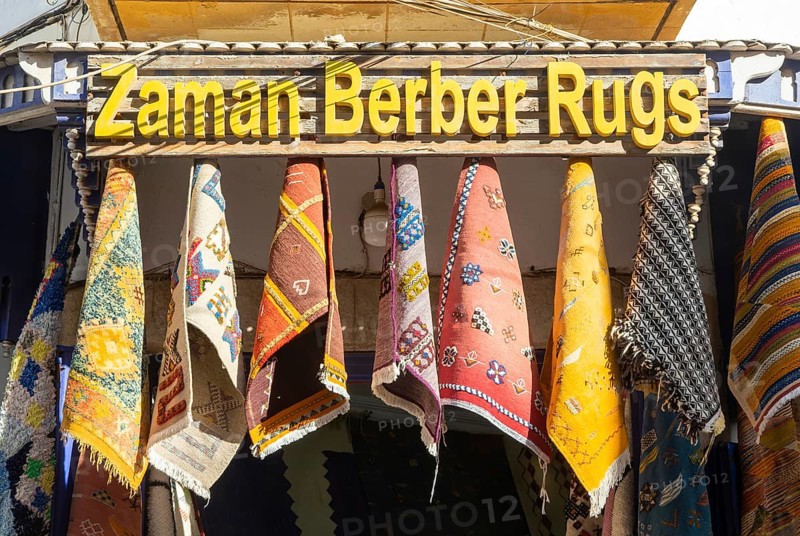 Traditional Berber rugs hanging on display outside shop in medina area of Essaouira, Morocco, north Africa, Africa