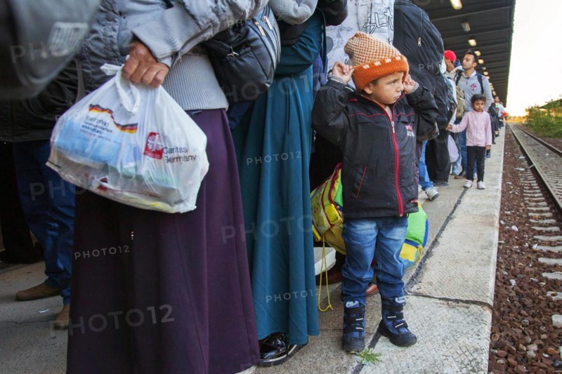 Syrian refugees arrive at Schönefeld station on a special train. They are then taken by bus to accommodation in Berlin, 01.10.2015
