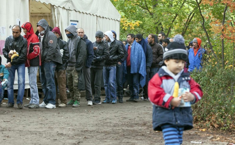 Refugees from Syria waiting to be registered at the Central Reception Centre for Asylum Seekers at the Berlin State Office for Health and Social Affairs, queue at the food counter, 09/10/2015