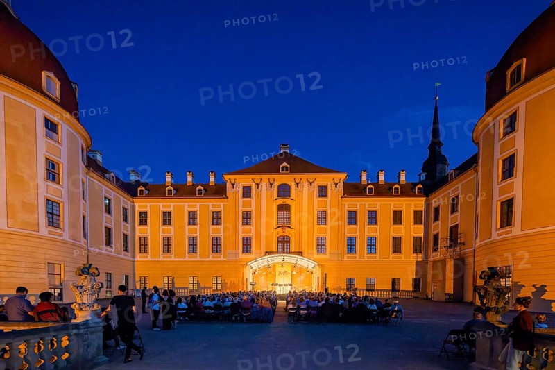 The Moritzburg Festival is an annual chamber music event in Saxony. It was founded in 1993 in Moritzburg by the soloists Kai Vogler, Peter Bruns and Jan Vogler. In Moritzburg, the artists find the ideal setting for the realisation of their musical dreams. The Moritzburg Festival, which has been under the sole artistic direction of cellist Jan Vogler since 2001, has long since established itself internationally as one of the most important festivals for chamber music thanks to its exceptional quality. Here is an evening concert on the north terrace of the baroque palace, Moritzburg Chamber Music Festival, Moritzburg, Saxony, Germany, Europe