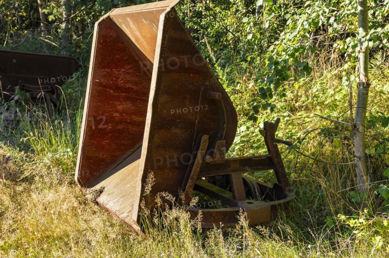 Old dilapidated rusty wagons of a light railway in an abandoned quarry, West Lusatia, Saxony, Germany, Europe