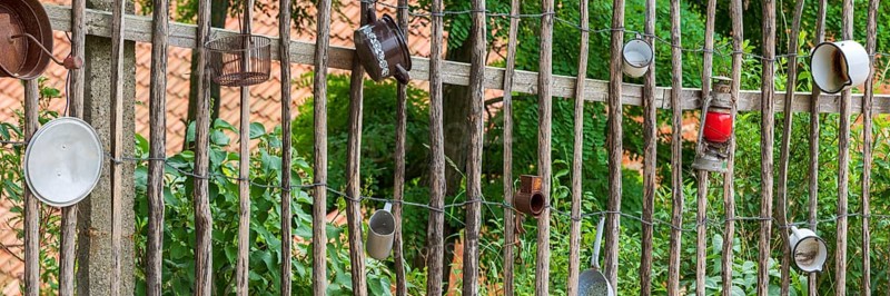Traditional wooden fence, farm fence, decorated with old pots and utensils, rural idyll, country life, Langenstein, Harz, Saxony-Anhalt, Germany, Europe