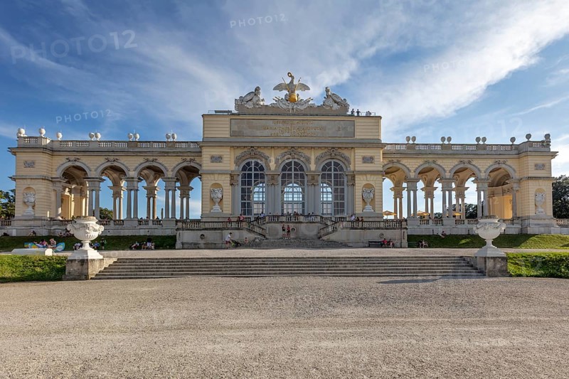 Historic Gloriette with arches under a blue sky, classical style, Vienna